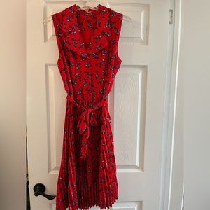 T Tahari, red, sleeveless dress with blue and white flowers. Size 10.